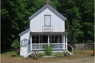 exterior image of two store general store with front porch, titled Hay's General Store